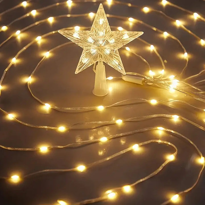 LED-lit pre-installed artificial Christmas tree with cascading star topper and ornament-ready branches