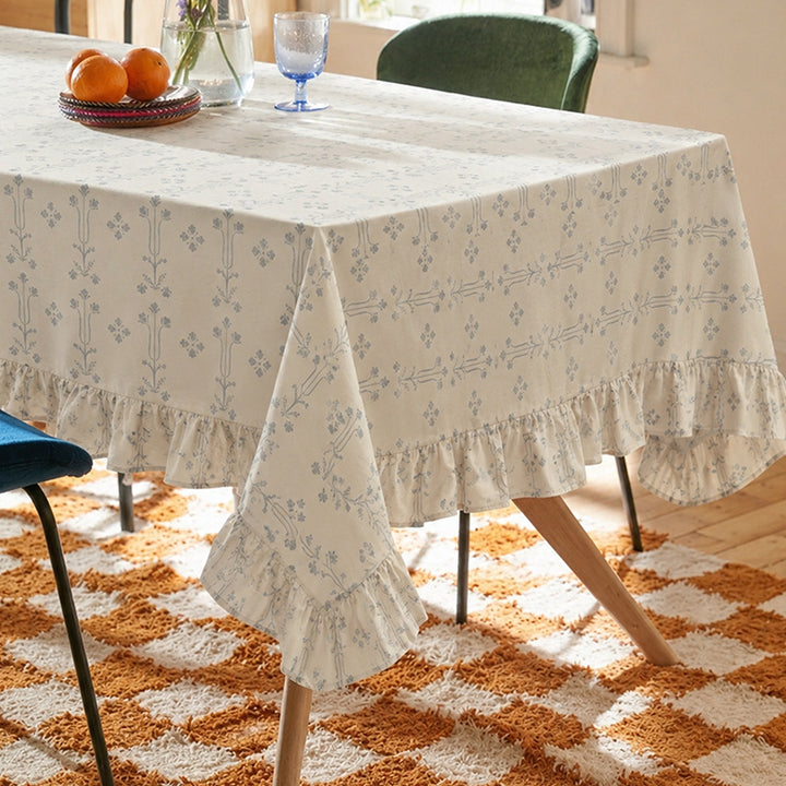 Rectangular tablecloth with ruffled border and delicate floral jacquard