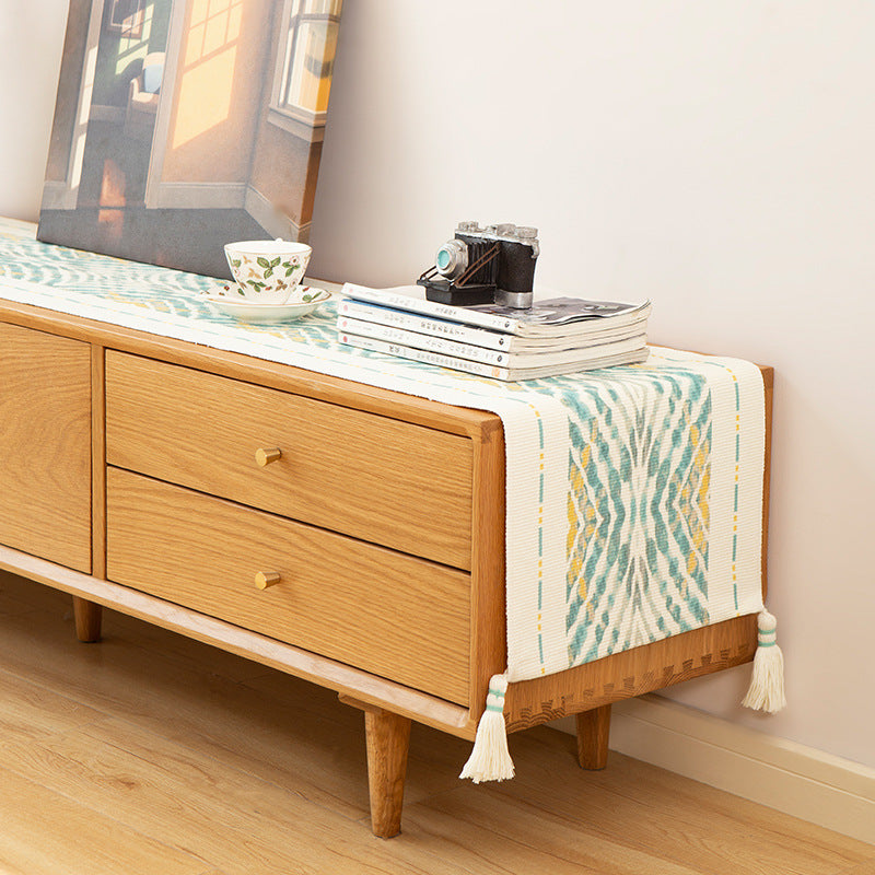 Handwoven decorative table runner with Ikat jacquard and tassels