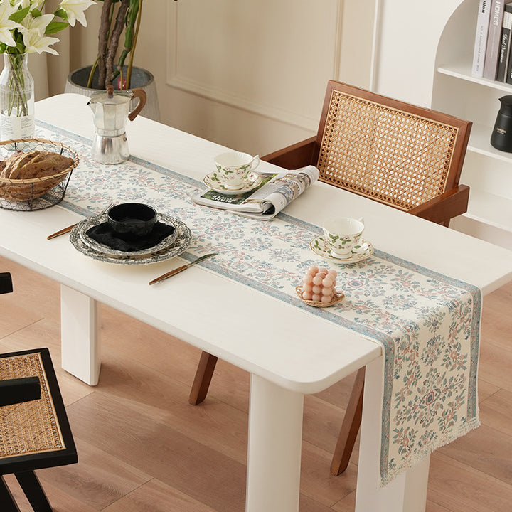 Woven jacquard table runner with floral medallion and fringes