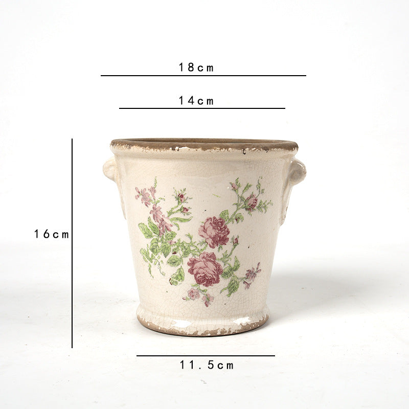 Decorative flower pot with floral embellishments