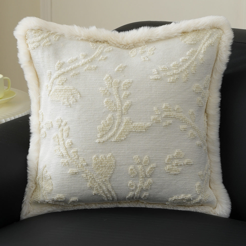 Square decorative pillow with embossed circular relief and soft faux fur edging