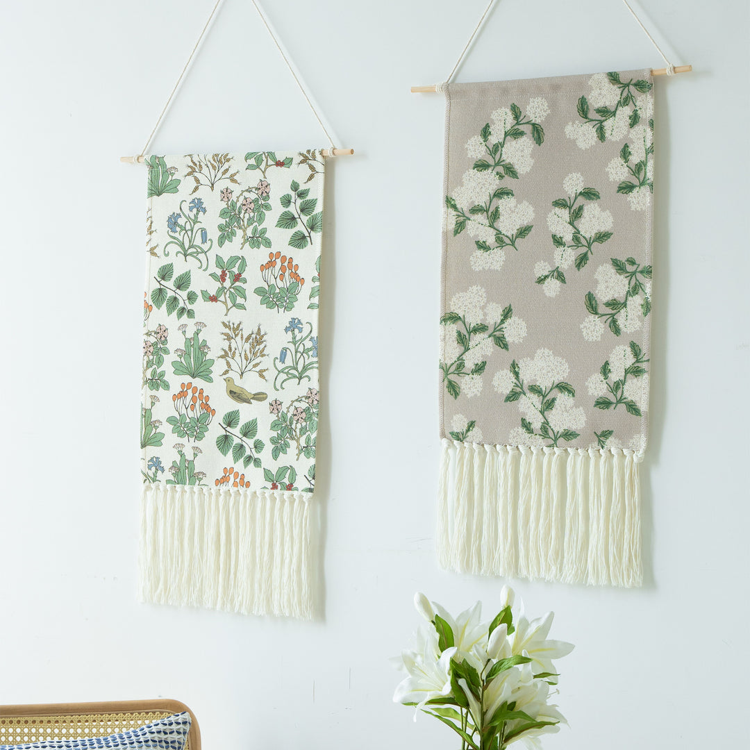 Woven wall hanging with floral jacquard structure and long fringes