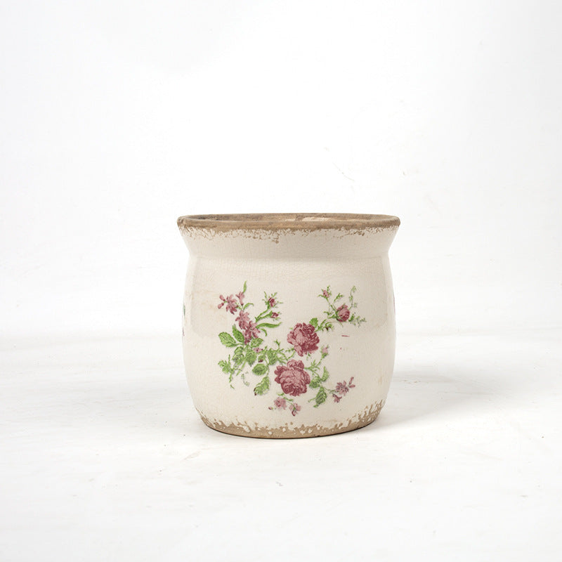 Decorative ceramic plant container with artistic design
