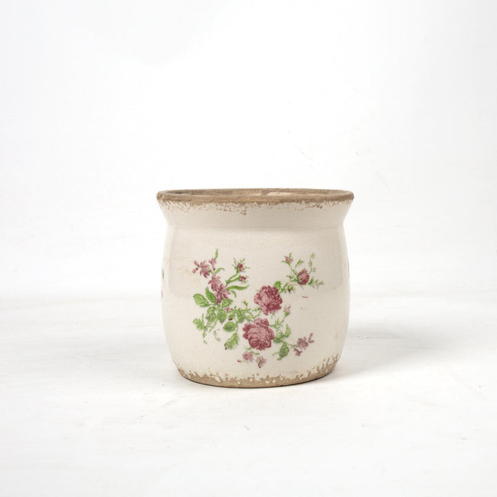 Decorative ceramic plant container with artistic design