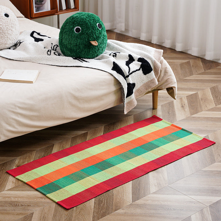 Flat-woven runner rug with check pattern and decorative border stripe