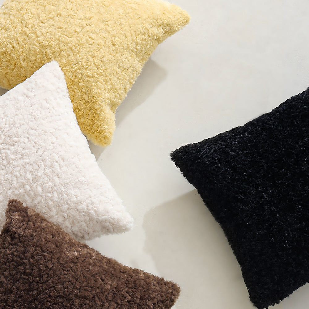 Modern decorative pillow in lambskin look with dense high pile structure