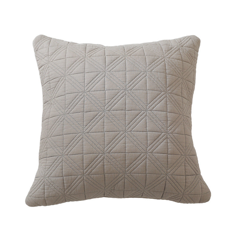 Square quilted decorative cushion made of cotton blend fabric with geometric cross quilted pattern