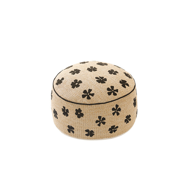 Flower-shaped floor pouf with cuddly teddy fleece surface and removable cover