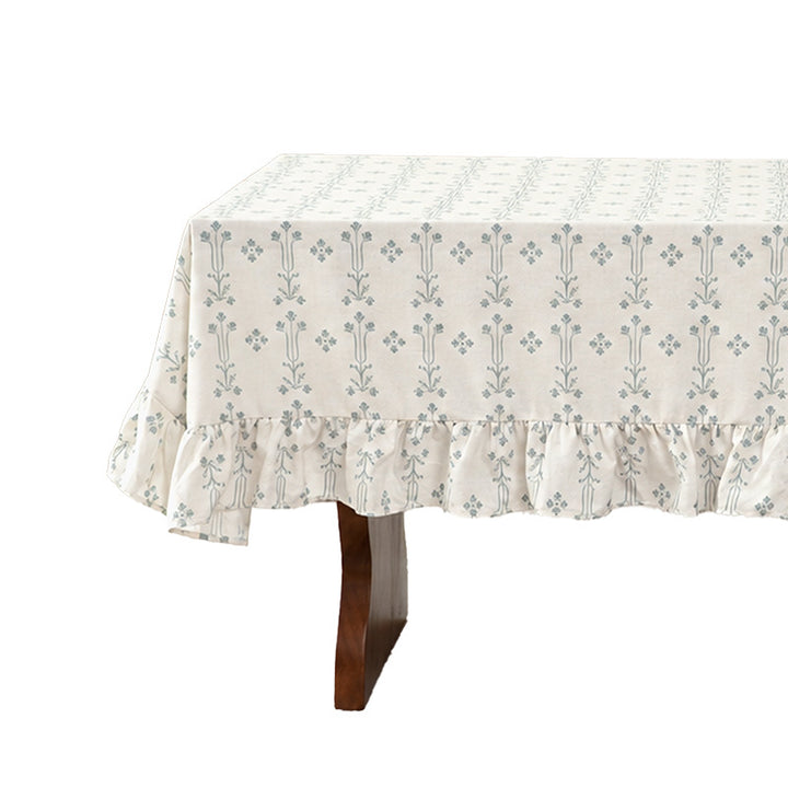 Rectangular tablecloth with ruffled border and delicate floral jacquard