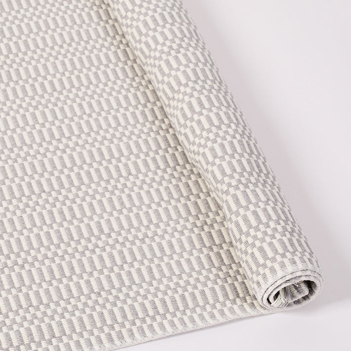 Flat-woven cotton rug runner with geometric check pattern and easy-care surface
