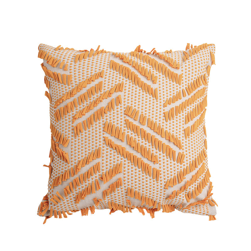 Decorative pillow with woven chenille relief structure and fringe application