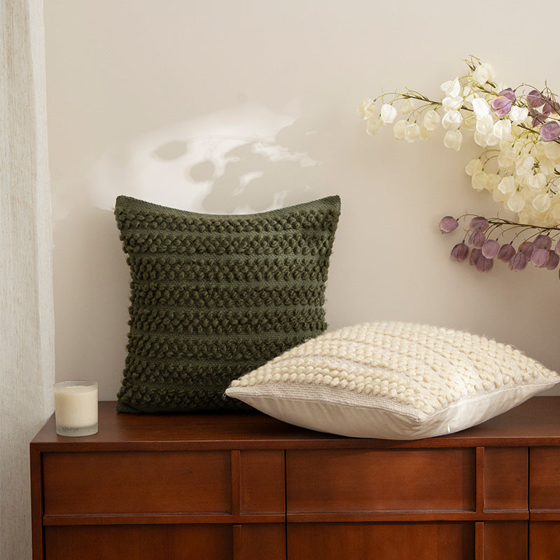 Structured knitted cushion with bobble look