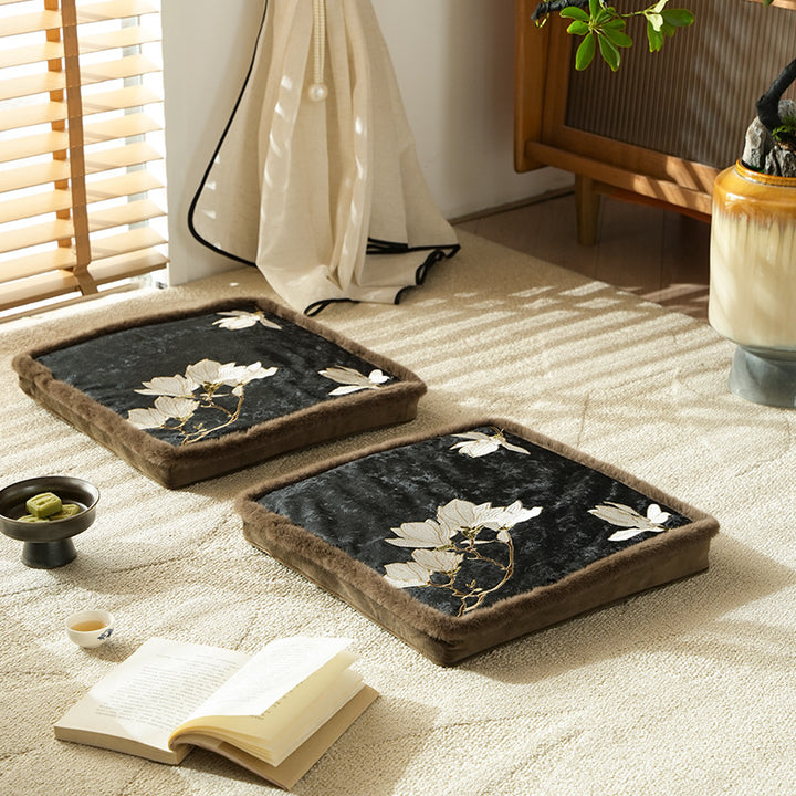 Padded seat cushion with velvet cover, floral embroidery and faux fur trim