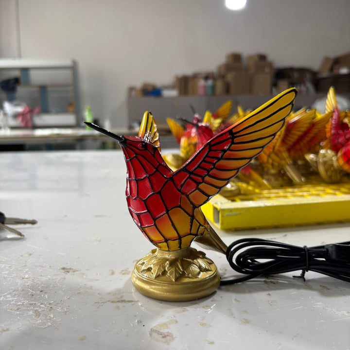 Decorative table lamp in the shape of a hummingbird
