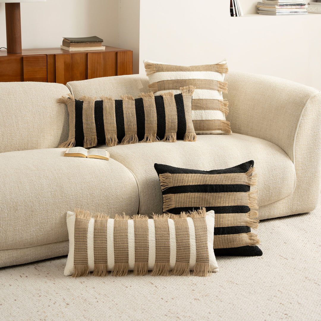 Rectangular boucle decorative pillow with hand-woven jute stripes and long fringes