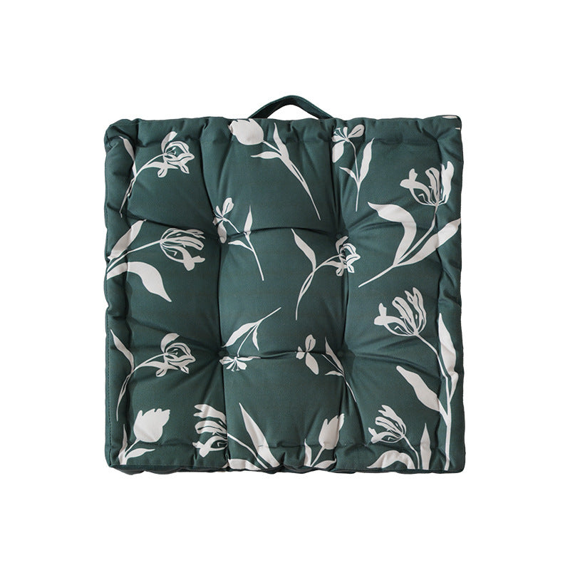 Padded chair cushion with carrying handle and decorative stitching