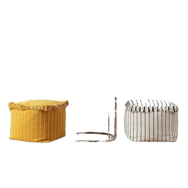Woven decorative pouf with fringes and structured striped look
