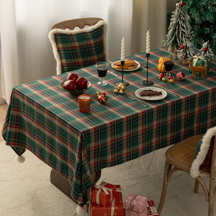 Rectangular checkered tablecloth made of cotton blend with pompom tassels