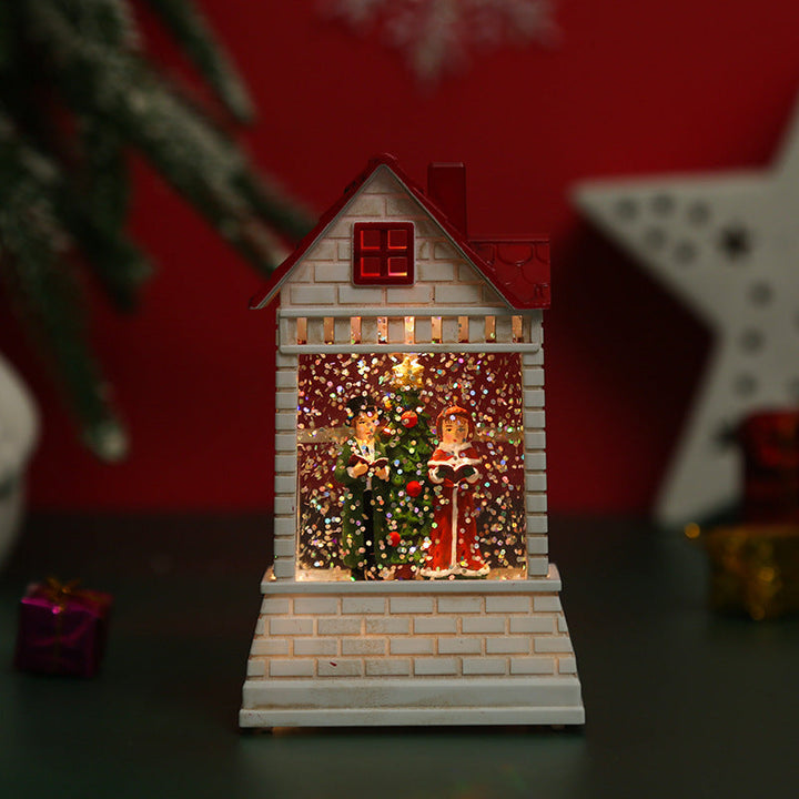 Illuminated Christmas village with moving figures