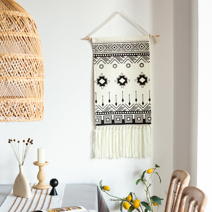 Woven cotton blend wall hanging with graphic ethnic pattern and long fringes