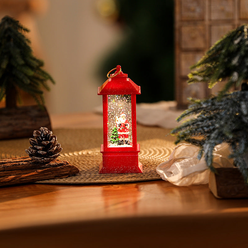 Illuminated Christmas lantern with glittering snowman scene