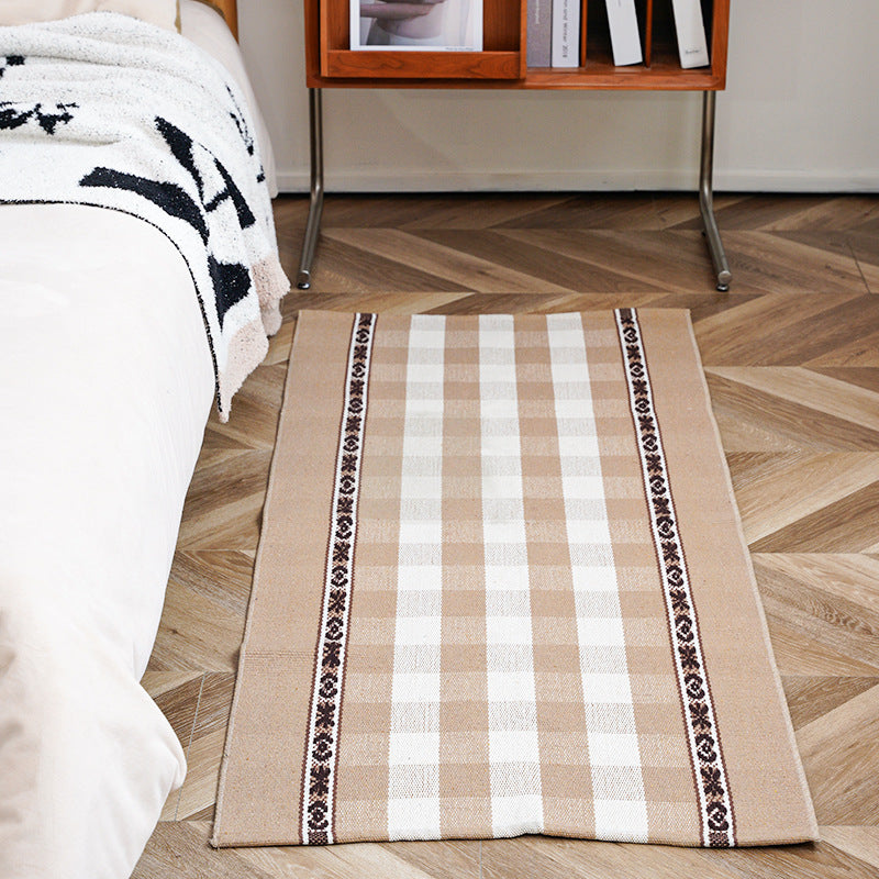 Flat-woven runner rug with check pattern and decorative border stripe