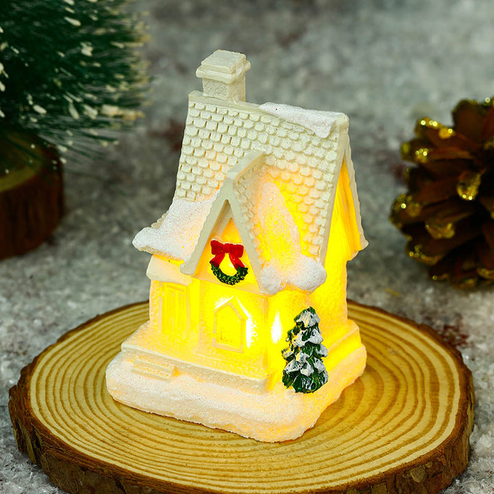 Illuminated Christmas village house with festive decoration