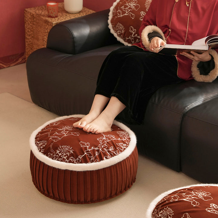 Round velvet floor pouf with floral embroidered top and faux fur trim
