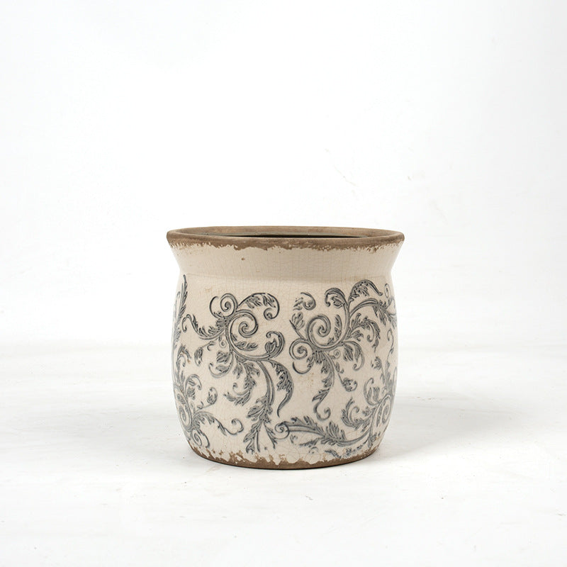 Decorative ceramic plant container with artistic design