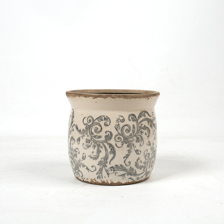 Decorative ceramic plant container with artistic design