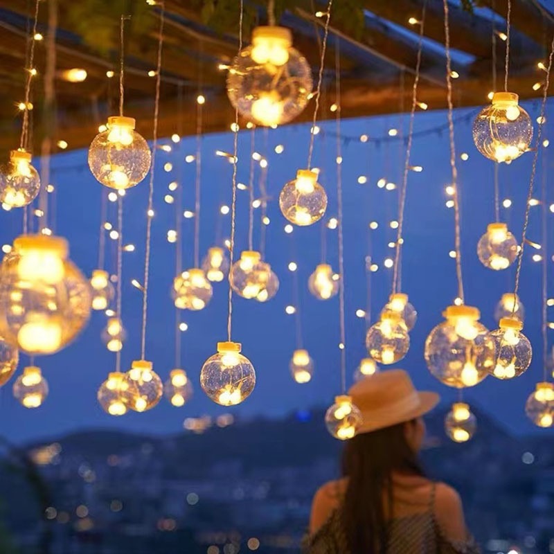 Hanging star and crescent moon LED curtain string lights for bedroom ambiance