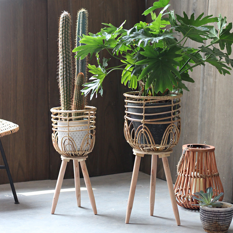Stylish plant stand made of rattan and wood