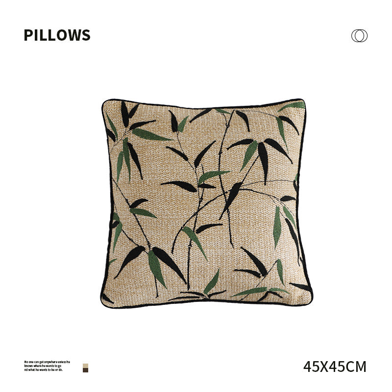 Square decorative pillow with embroidered bamboo design and natural linen texture