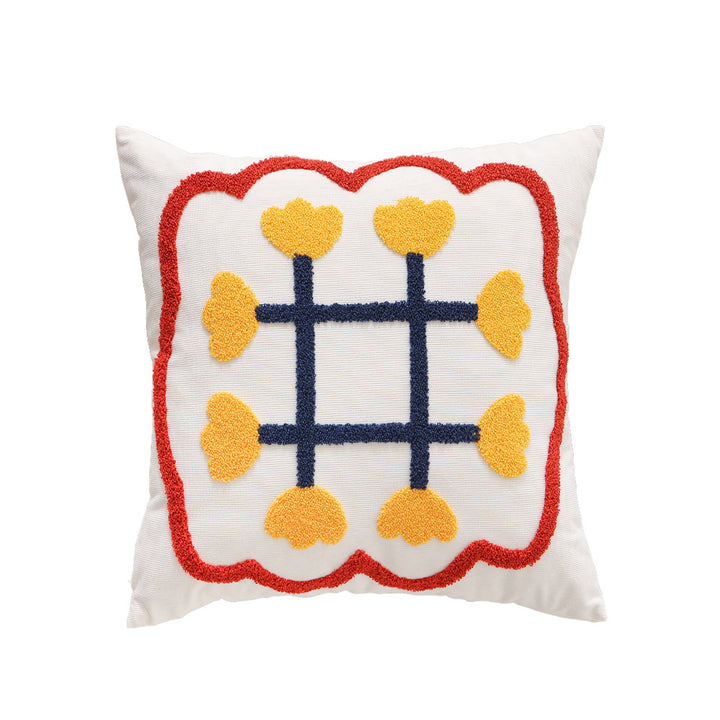 Square decorative cushion with hand-tufted heart ornament and contrasting border