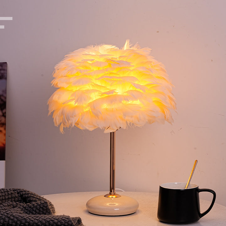 Feather shade table lamp with ceramic base and polished metal rod