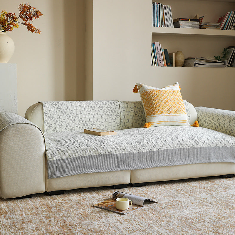 Sofa cover and sofa runner made of knitted cotton blend with non-slip edge