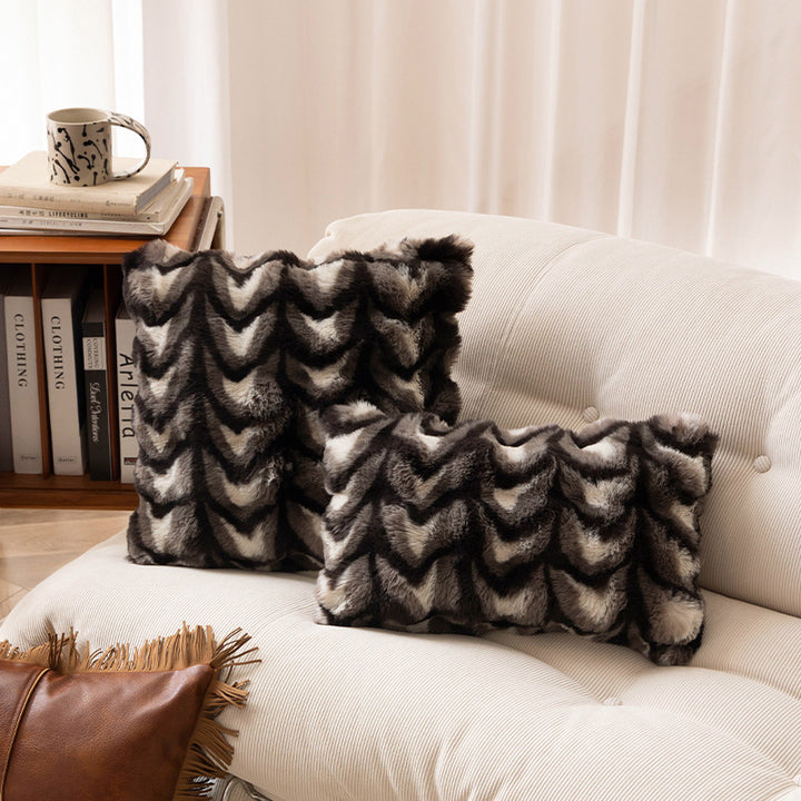 Rectangular decorative cushion made of faux fur with chevron relief and cozy filling