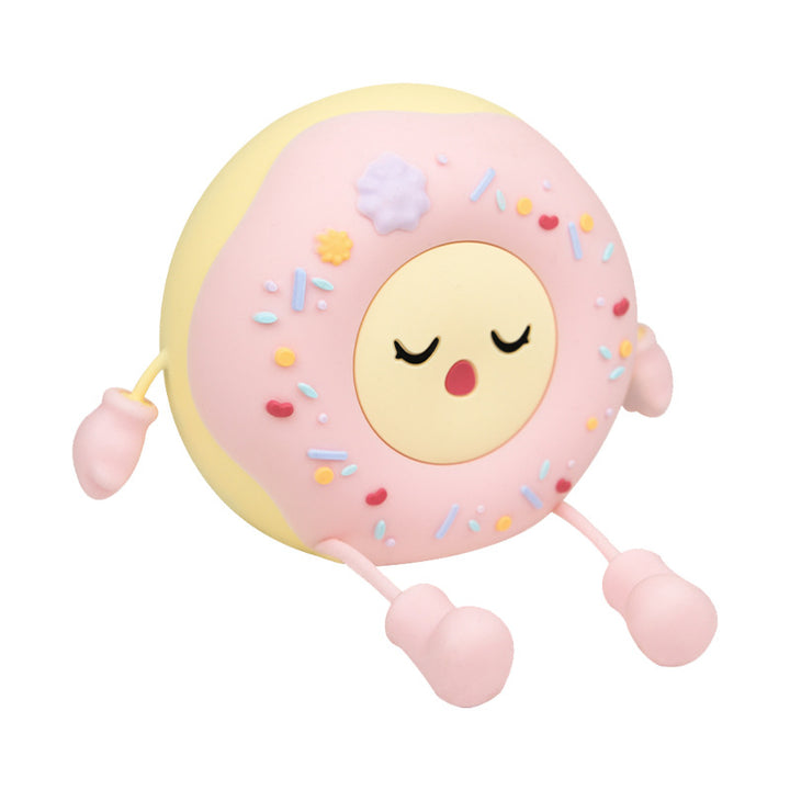 Whimsical silicone-shaped LED night light in donut form with flexible limbs