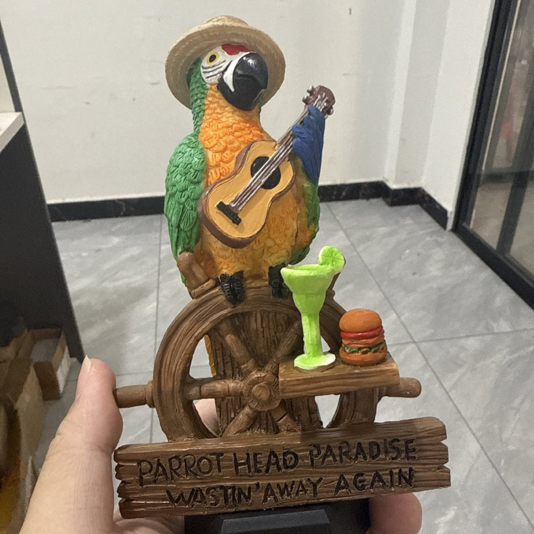 Decorative figure of a funny parrot with drink and guitar