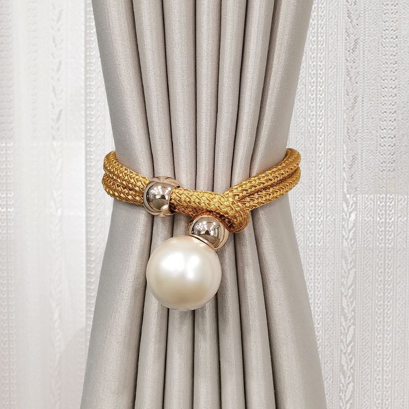 Elegant curtain tieback with decorative pearl