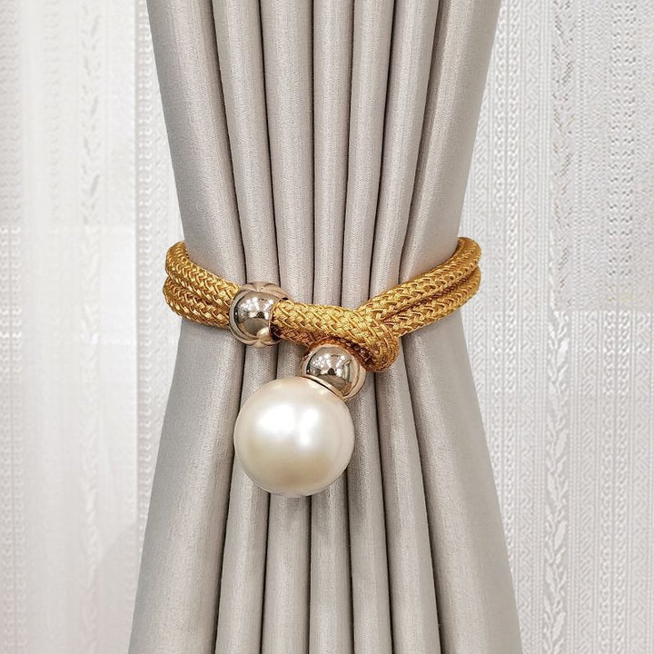 Elegant curtain tieback with decorative pearl