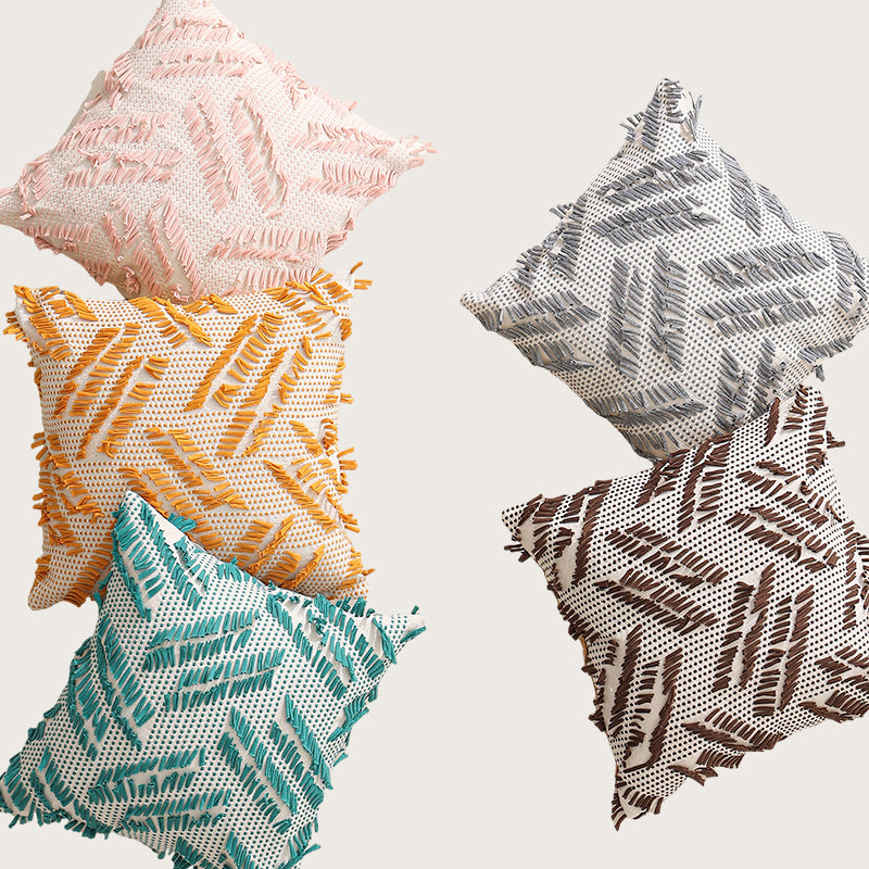 Decorative pillow with woven chenille relief structure and fringe application