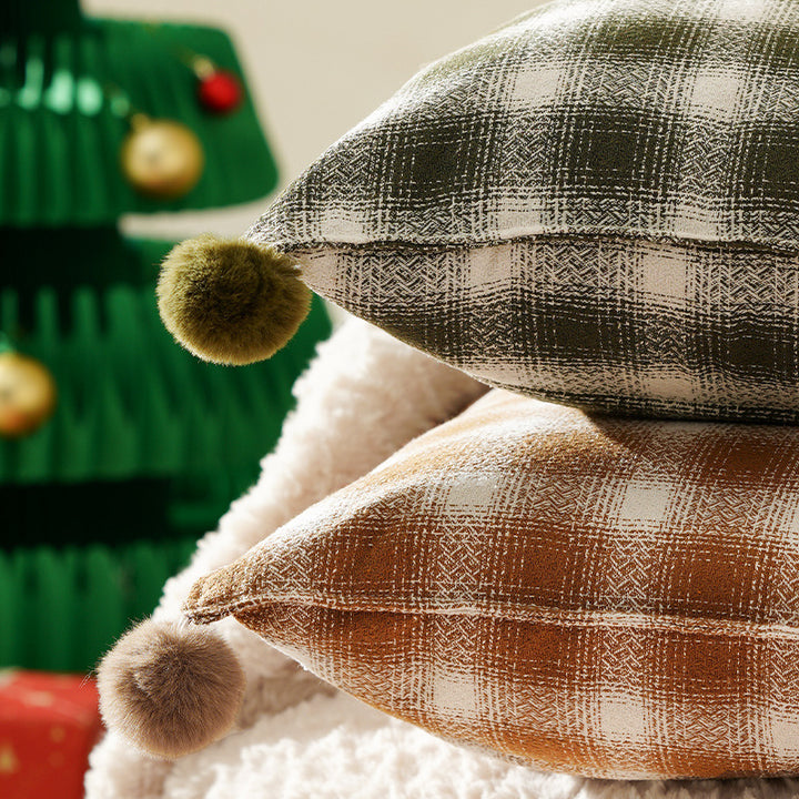 Decorative square cushion cover with pompom corners and checkered jacquard pattern