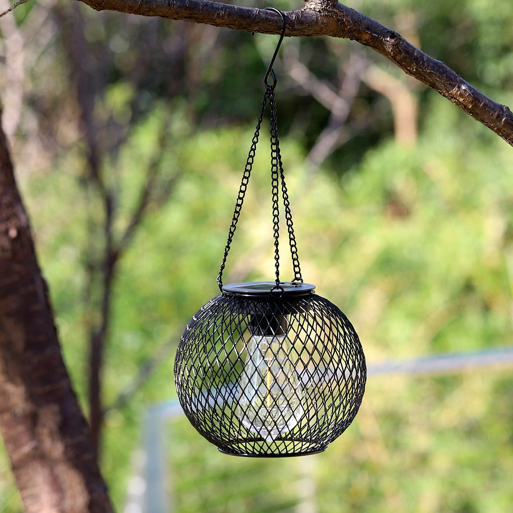 Weatherproof hanging solar LED lanterns for outdoor use with metal cage, warm glass, and hanging chain