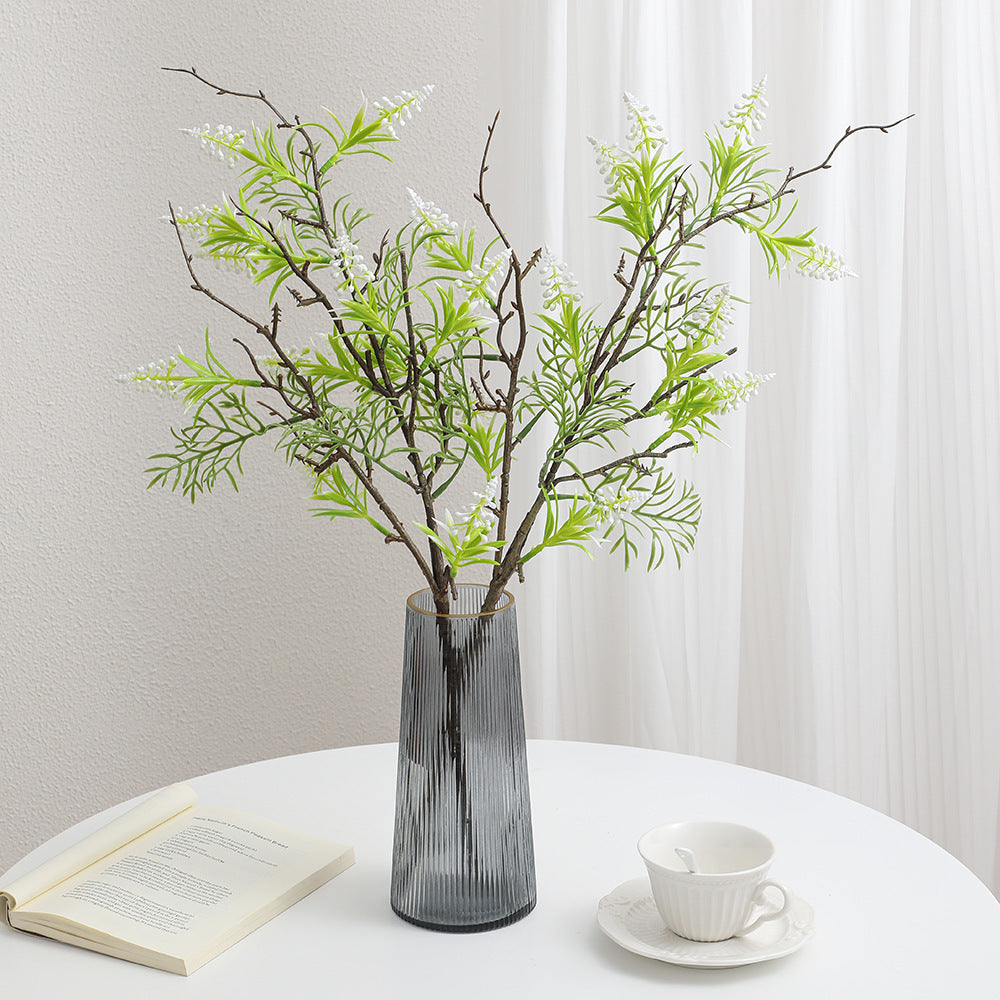 Artificial plant with decorative flowers