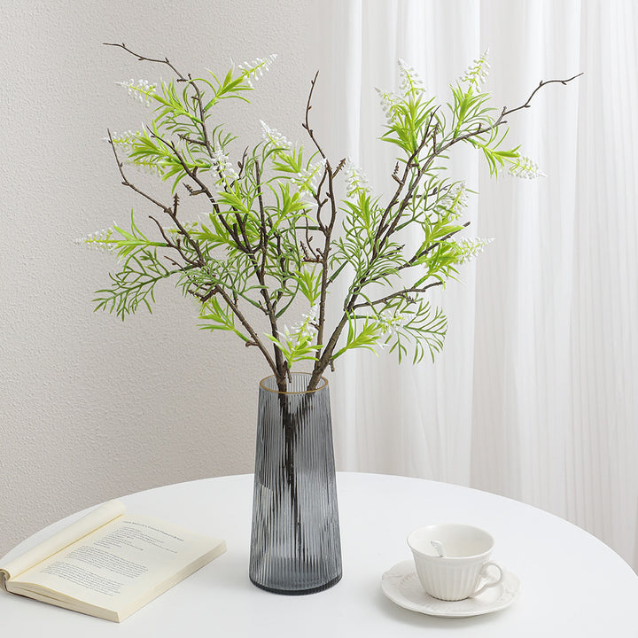 Artificial plant with decorative flowers