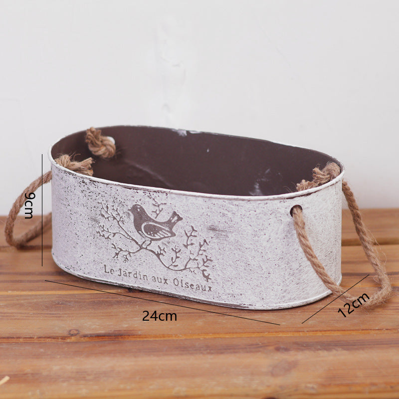 Decorative storage basket made of metal with natural design