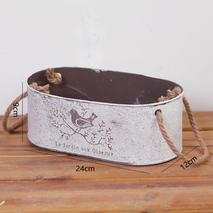 Decorative storage basket made of metal with natural design