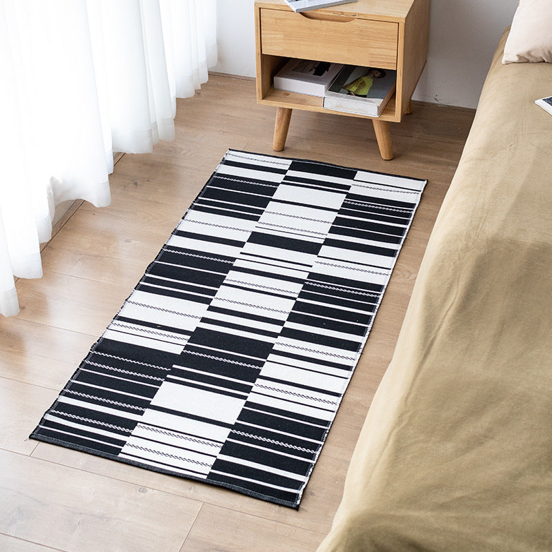 Flat-woven kitchen runner with modern striped pattern and easy-care cotton blend